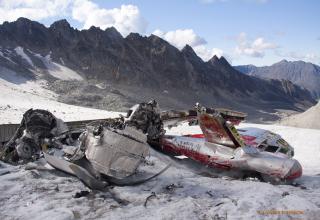 Alaska's majestic Talkeetna Mountains are almost so grand that you might not see the giant airplane tire embedded into the glacier before bumping into it.