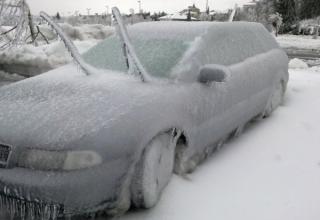 cars covered in snow and ice