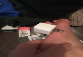 girl's phone charger goes into her foot